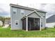 Exterior view of home with screened in porch and view of the lawn at 10024 Fox Trotter Ln, Midland, NC 28107