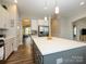 Open kitchen layout featuring an island, stainless steel appliances, and ample cabinets at 10024 Fox Trotter Ln, Midland, NC 28107