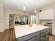 Spacious kitchen with island, stainless steel appliances, and an open view of the living room at 10024 Fox Trotter Ln, Midland, NC 28107