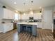 Beautiful kitchen featuring an island, stainless appliances, and white cabinets at 10024 Fox Trotter Ln, Midland, NC 28107