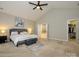 Large main bedroom with vaulted ceilings, soft carpet, and an en-suite bathroom and walk-in closet at 10024 Fox Trotter Ln, Midland, NC 28107