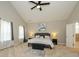 Spacious main bedroom featuring a vaulted ceiling, soft carpet, and stylish accent furniture and artwork at 10024 Fox Trotter Ln, Midland, NC 28107