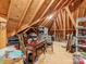 Unfinished attic space with exposed wooden beams and ample storage potential at 10626 Newberry Park Ln, Charlotte, NC 28277