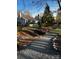 Picturesque backyard featuring a stream, bridge, and landscaped surroundings at 10626 Newberry Park Ln, Charlotte, NC 28277