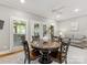 Cozy breakfast nook with a round table, four chairs, natural light and hardwood floors at 10626 Newberry Park Ln, Charlotte, NC 28277