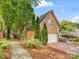 Charming brick home featuring a well-manicured front yard and a paved driveway at 10626 Newberry Park Ln, Charlotte, NC 28277
