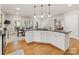 Open concept kitchen with granite counters that flows into the breakfast nook and living spaces at 10626 Newberry Park Ln, Charlotte, NC 28277