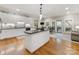 Spacious kitchen with a center island that opens to a dining and living area at 10626 Newberry Park Ln, Charlotte, NC 28277