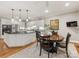 Bright eat-in kitchen featuring white cabinetry, granite countertops and stainless steel appliances at 10626 Newberry Park Ln, Charlotte, NC 28277