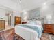 Serene main bedroom with warm lighting, a decorative rug and detailed wood furniture at 10626 Newberry Park Ln, Charlotte, NC 28277
