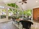 Relaxing screened-in porch with comfortable seating and views of the lush backyard at 10626 Newberry Park Ln, Charlotte, NC 28277