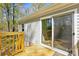 Exterior shot of the home's back deck with a sliding glass door and grey siding at 110 Matthew Dr, Kings Mountain, NC 28086