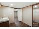 Bathroom with vanity, tile countertop, and view to the bedroom and closet at 110 Matthew Dr, Kings Mountain, NC 28086