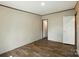 Bedroom features wood-look flooring, base and crown molding, a light fixture, and access to another room at 110 Matthew Dr, Kings Mountain, NC 28086