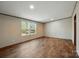 Bright bedroom with wood-look floors and a view of the outdoors from the window at 110 Matthew Dr, Kings Mountain, NC 28086