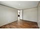 Bedroom with wood-look flooring, base and crown molding, a light fixture, and an interior door at 110 Matthew Dr, Kings Mountain, NC 28086
