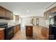 Open kitchen layout with wood cabinets, center island, and seamlessly flowing living spaces at 110 Matthew Dr, Kings Mountain, NC 28086