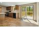 Eat-in kitchen featuring dark wood cabinets, stainless steel appliances, and deck access at 110 Matthew Dr, Kings Mountain, NC 28086