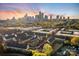 Aerial shot showcasing townhome community with city skyline in the background at 11039 Stetler St, Charlotte, NC 28204