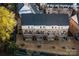 Aerial view of townhome backyards with wooden decks and privacy fences, new landscaping, and modern architecture at 11039 Stetler St, Charlotte, NC 28204