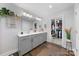 Modern bathroom with double vanity, gold fixtures, and walk-in closet access at 11039 Stetler St, Charlotte, NC 28204