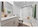 Modern bathroom with a shower-tub combo, a white vanity, and contemporary fixtures at 11039 Stetler St, Charlotte, NC 28204