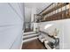 Inviting foyer with hardwood floors, a staircase, and stylish console table creates a warm and welcoming atmosphere at 11039 Stetler St, Charlotte, NC 28204