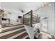 Welcoming entryway with hardwood floors, stairs, and elegant railings offers a bright and airy feel at 11039 Stetler St, Charlotte, NC 28204