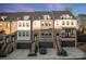 Beautiful townhome with brick accents, attached garages, and individual staircases leading to private entrances at 11039 Stetler St, Charlotte, NC 28204