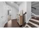 Inviting hallway with hardwood floors, natural light, and a stairway at 11039 Stetler St, Charlotte, NC 28204