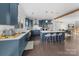 Modern kitchen with navy cabinets, white countertops, stainless steel appliances, and a stylish island with seating at 11039 Stetler St, Charlotte, NC 28204