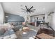 Spacious living room with hardwood floors, modern decor, and open layout flows seamlessly into dining and kitchen at 11039 Stetler St, Charlotte, NC 28204
