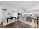 Bright open-concept living space with hardwood floors, modern furniture, and seamless flow to dining area at 11039 Stetler St, Charlotte, NC 28204