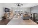 Bright living room features large windows, hardwood floors, and an open layout with a cozy sectional sofa at 11039 Stetler St, Charlotte, NC 28204
