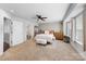 Spacious main bedroom features neutral carpet, a ceiling fan, a bench seat and a walk-in closet at 11039 Stetler St, Charlotte, NC 28204