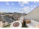 Rooftop patio with artificial turf, seating, a fire pit and a view of the city skyline at 11039 Stetler St, Charlotte, NC 28204