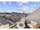 Rooftop patio with artificial turf, seating, a fire pit and a view of the city skyline at 11039 Stetler St, Charlotte, NC 28204