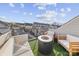 Rooftop patio with artificial turf, seating, a fire pit and a view of the city skyline at 11039 Stetler St, Charlotte, NC 28204
