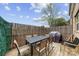 Cozy outdoor patio with a dining set and privacy fence, perfect for enjoying outdoor meals and relaxation at 11039 Stetler St, Charlotte, NC 28204