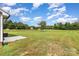 Spacious backyard with a concrete slab and views of the lush greenery at 115 Frances St, Salisbury, NC 28147