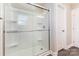 The bathroom features a modern glass-enclosed shower with built in shelves at 115 Frances St, Salisbury, NC 28147