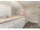 Bathroom with double vanity, granite counters, and enclosed shower with glass doors at 115 Frances St, Salisbury, NC 28147