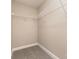 Walk in closet features wall to wall shelving and carpeted flooring at 115 Frances St, Salisbury, NC 28147