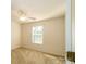 Cozy bedroom featuring plush carpeting, a ceiling fan, and a window with blinds for natural light at 11630 Lioness St, Charlotte, NC 28273