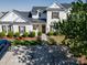 Well-maintained townhouse with white siding, green shrubs and mulch, and a paved driveway, situated in a desirable location at 11630 Lioness St, Charlotte, NC 28273