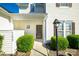 Charming front porch featuring manicured bushes, an outdoor lantern, and the house number for easy identification at 11630 Lioness St, Charlotte, NC 28273