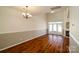 Bright living room with hardwood floors, high ceilings, a fireplace, and access to the backyard at 11630 Lioness St, Charlotte, NC 28273