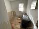Bathroom with natural light, with partial repair work evident at 119 Lineberger St, Stanley, NC 28164