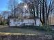 Charming single-story home with a covered front porch and mature trees in a serene setting at 119 Lineberger St, Stanley, NC 28164