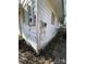 The corner of the house is shown with visible electrical boxes and old connections at 119 Lineberger St, Stanley, NC 28164